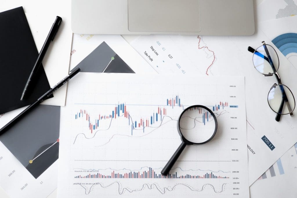 Glasses on Top of Chart of Business Expenses