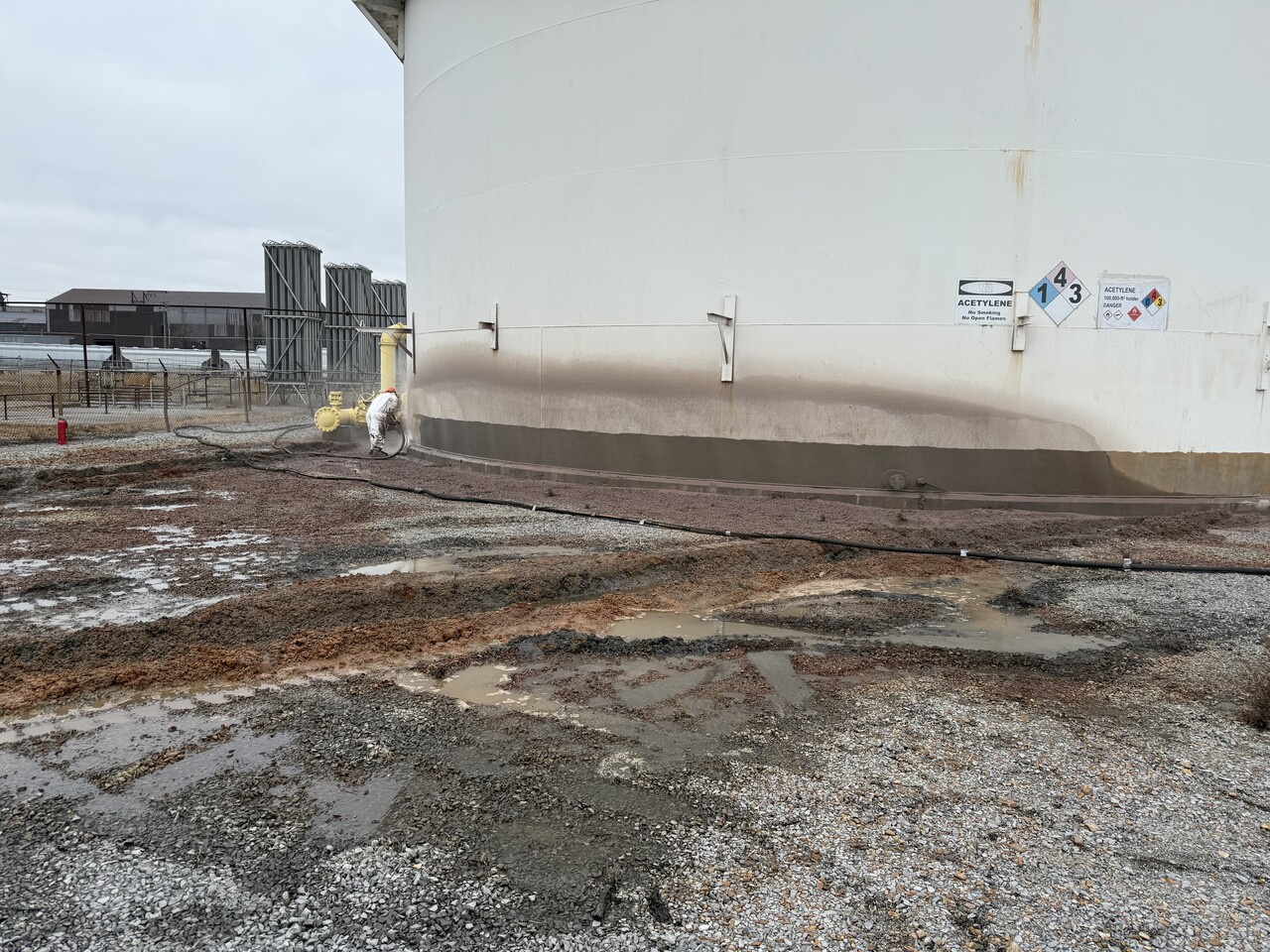 Tank floor before composite rehabilitation showing corrosion and deterioration