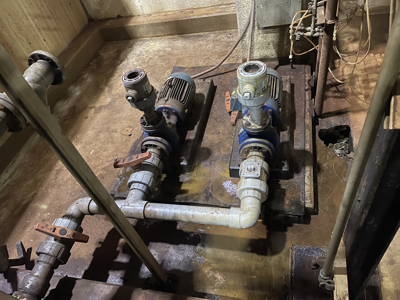 Before industrial coating project showing worn containment area surface before rehabilitation