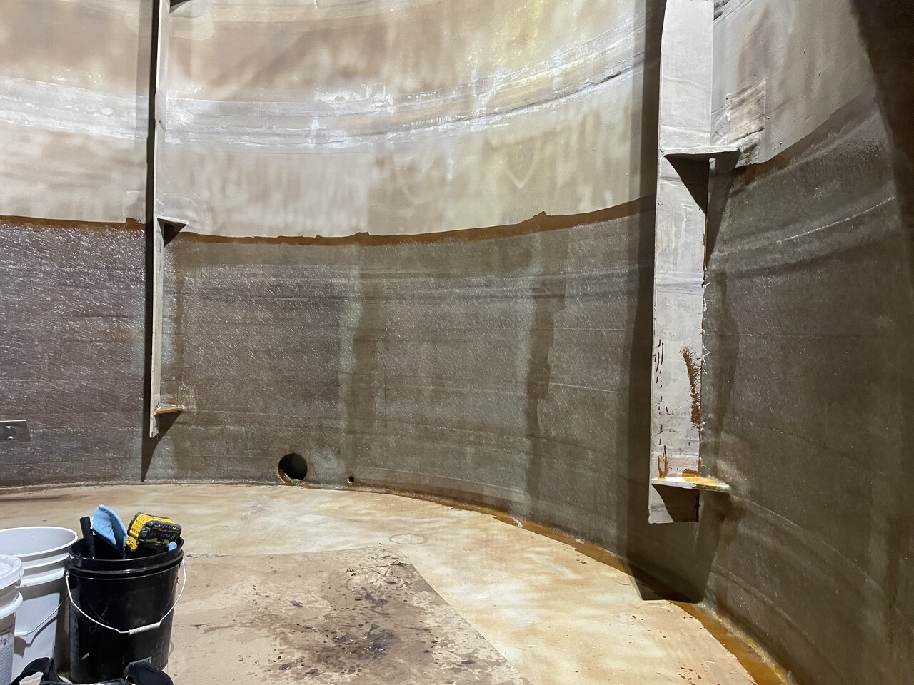 Interior of industrial fiberglass tank before rehabilitation