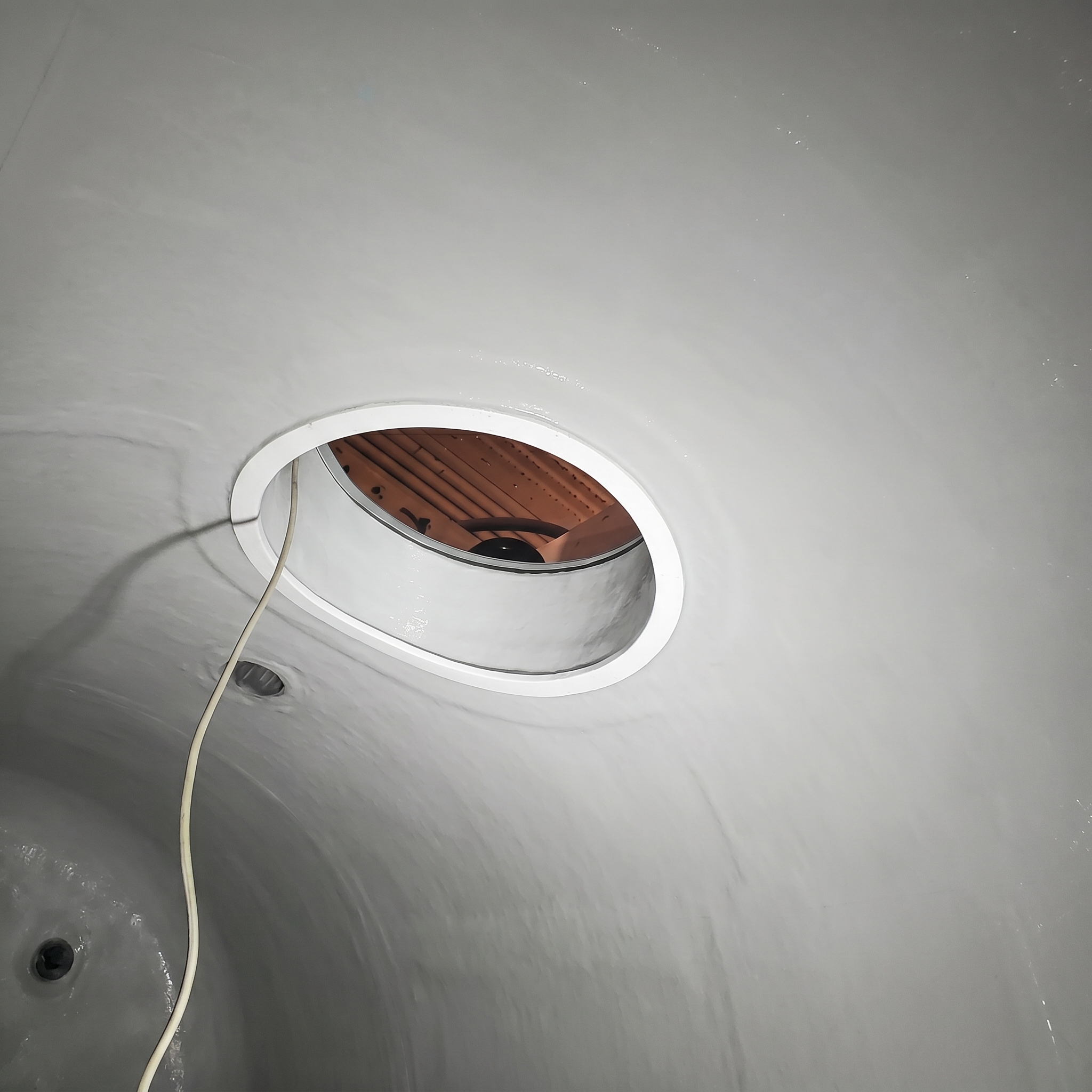 FRP tank interior after repair showing restored structure and lining