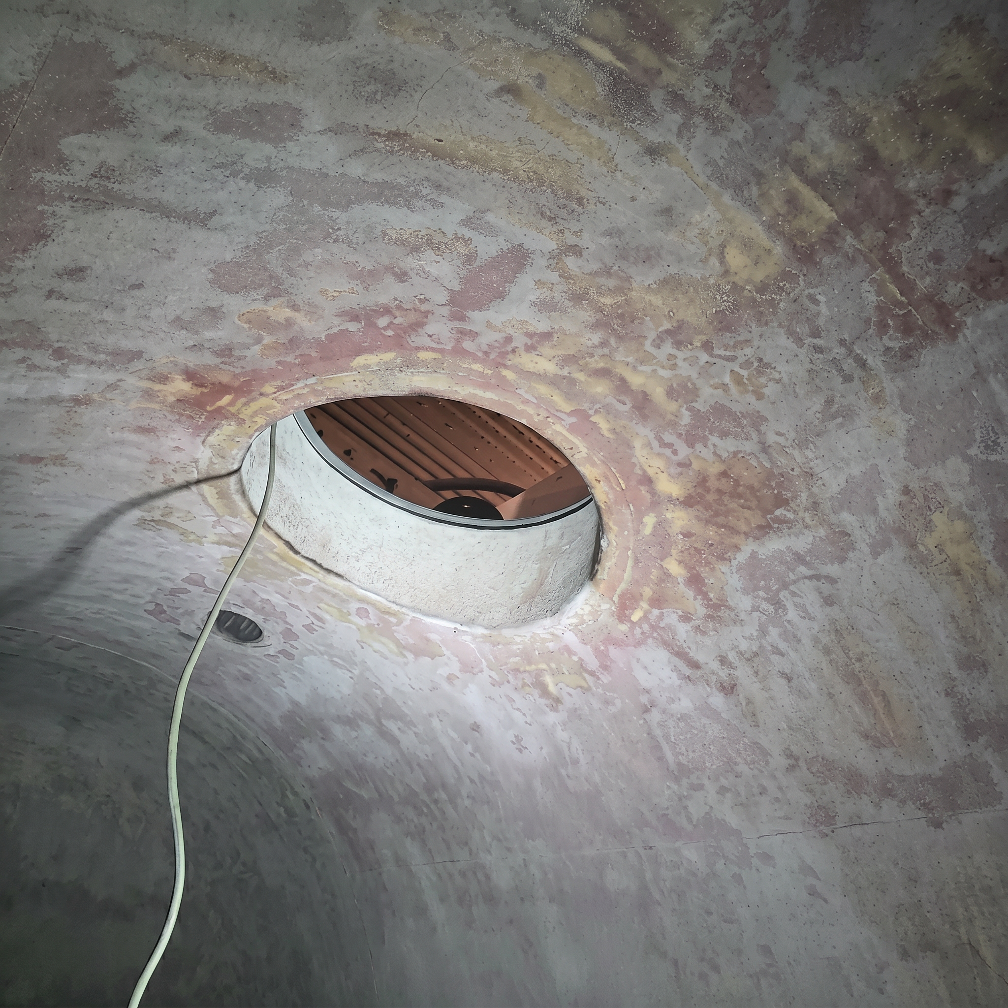 FRP tank interior before repair showing deterioration and failure