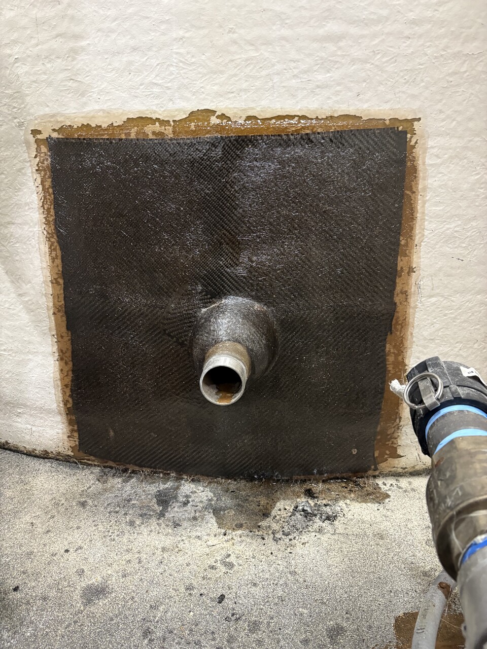 FRP tank after repair showing restored nozzle and structure