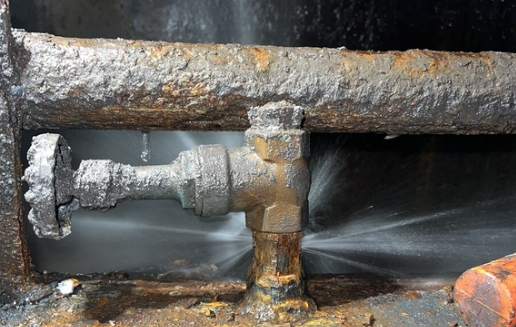 Industrial water line before leak repair