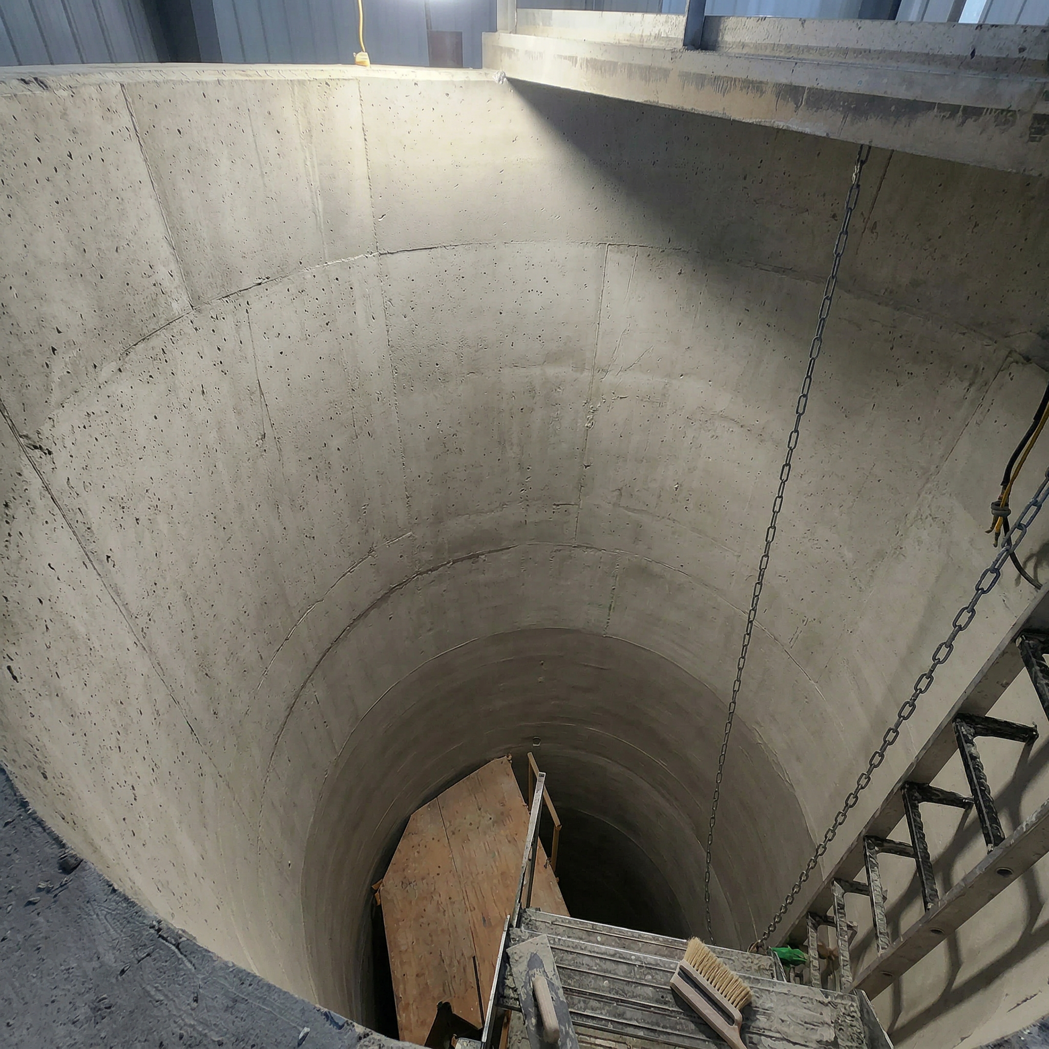 Before trowel-applied lining showing deteriorated tank surface