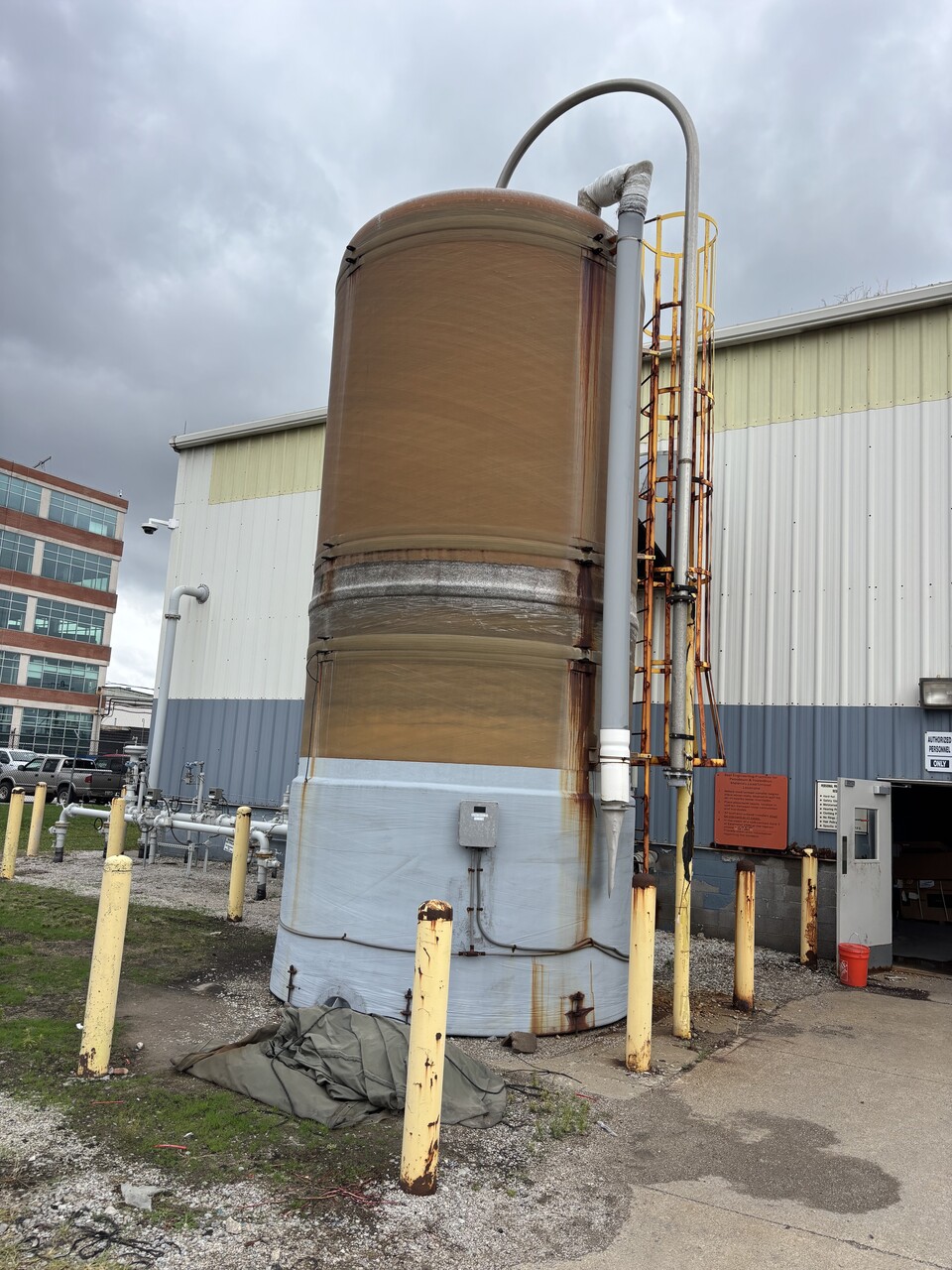 FRP tank before repair showing deterioration and damage